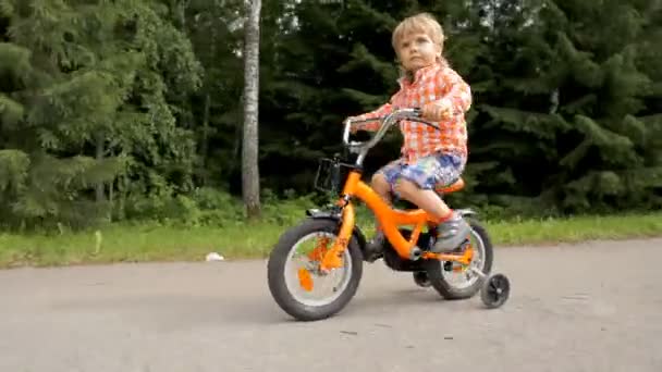 riding a bike with training wheels