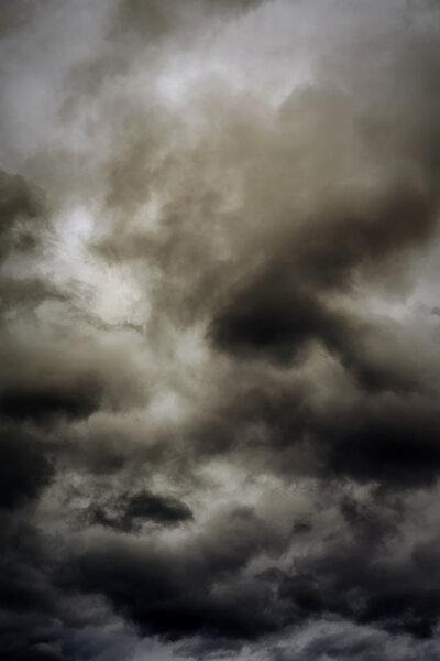Dark ominous clouds create a dramatic sky background.