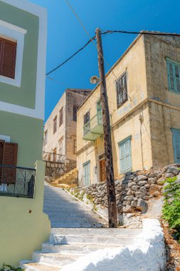 SYMI, GREECE - Temmuz 05, 2021: Symi bir Yunan adasıdır ve Dodecanese ada grubunun bir parçasıdır..