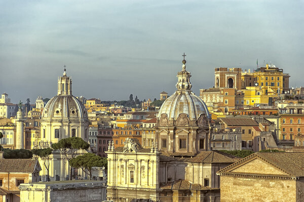 A sunlit cityscape of the Italian capital of Rome.
