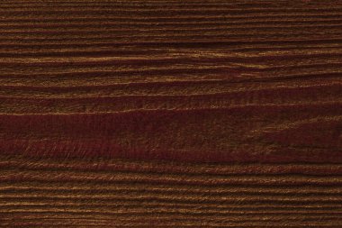 Koyu kahverengi ahşap tahtaya yakın altın renkli