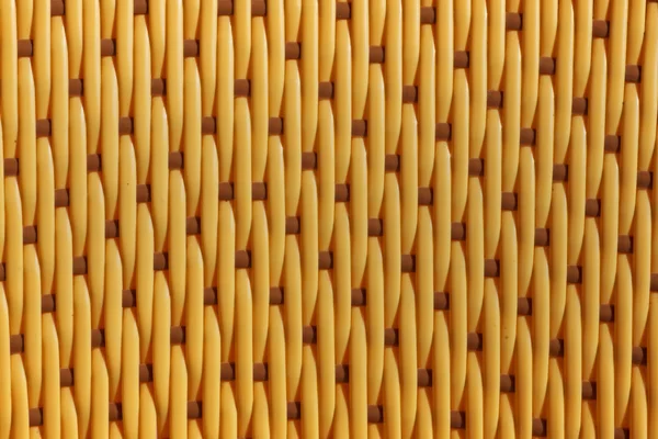 Yellow weaved plastic texture — Stock Photo, Image