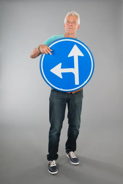 Senior man with two directions — Stock Photo, Image