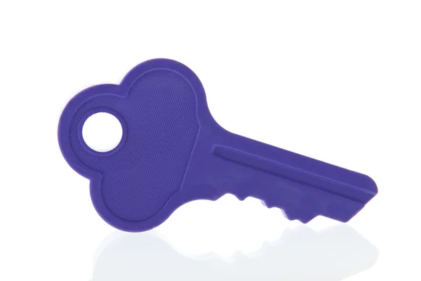 Purple key isolated over white background — Stock Photo, Image