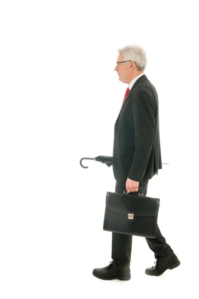 Senior affärsman med paraply — Stockfoto