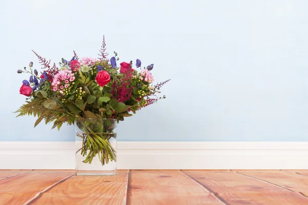 Mixed bouquet flowers on floor — Stock Photo, Image