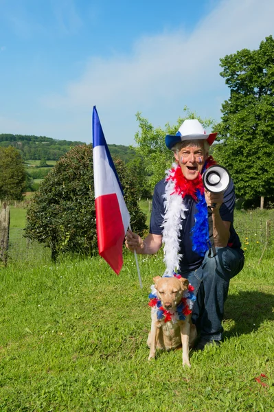 French Soccer fan with dog and megaphone — Stock Photo, Image