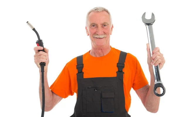 Happy man in orange and gray overall with wrench — Stock Photo, Image