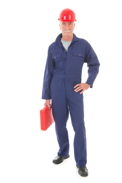 Mann in blauem Overall mit rotem Koffer — Stockfoto