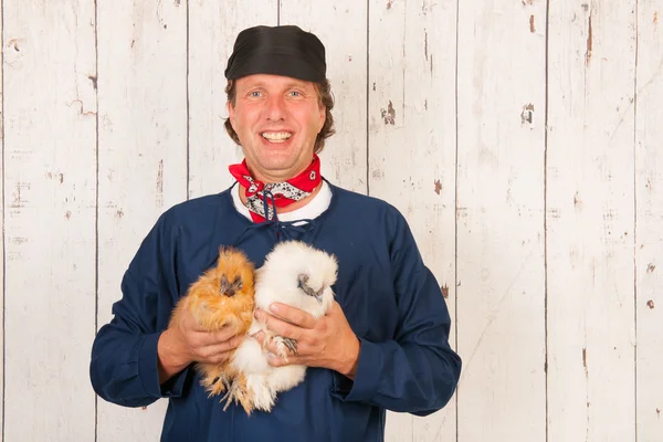 Agricultor com galinhas — Fotografia de Stock