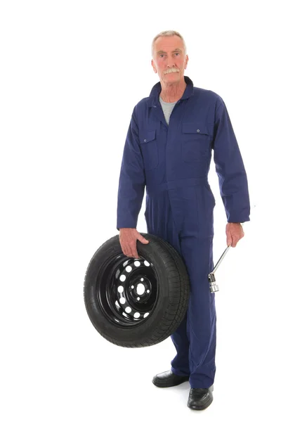 Mechanic with wheel and wrench — Stock Photo, Image