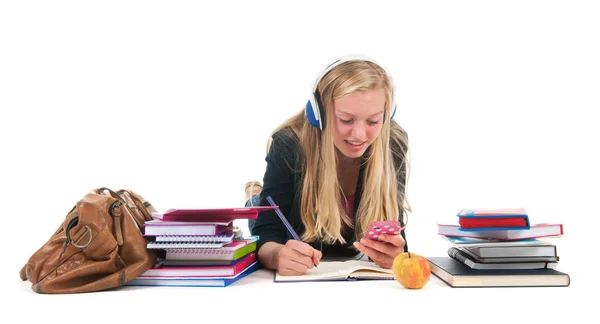 Teen flicka med läxor och smarphone — Stockfoto