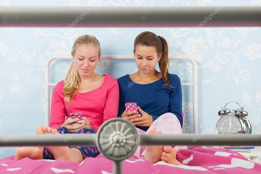Teen girls with smartphones