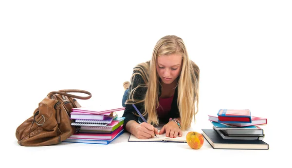 Adolescente chica haciendo tarea para la escuela — Foto de Stock