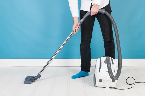 Man with vacuum cleaner — Stock Photo, Image