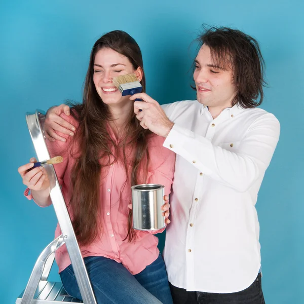 Young couple painting house — Stock Photo, Image