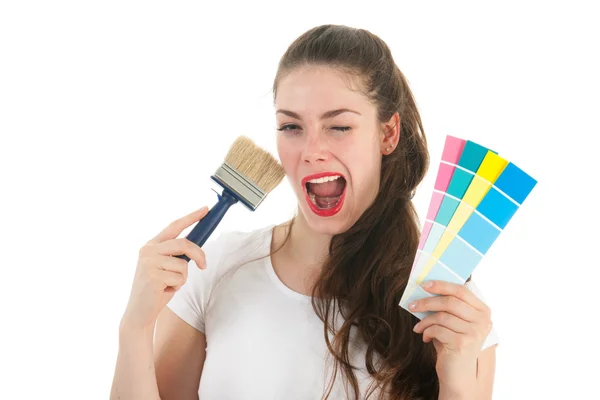 Portrait young adult with brush and samples — Stock Photo, Image