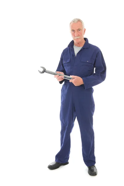 Homem em azul em geral com chave inglesa — Fotografia de Stock