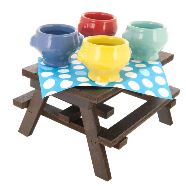 Picnic table with soup bowls — Stock Photo, Image