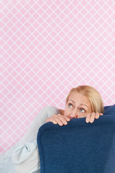 Fear in the chair by woman af mature age — Stock Photo, Image