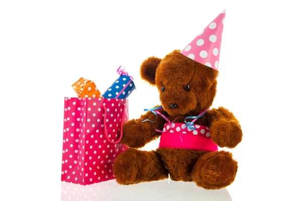 Смешной плюшевый медведь с подарками — стоковое фото