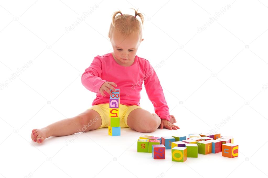 Toddler girl playing with blocks