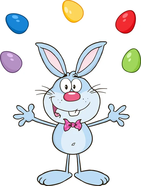 Conejo malabares con huevos de Pascua . — Vector de stock
