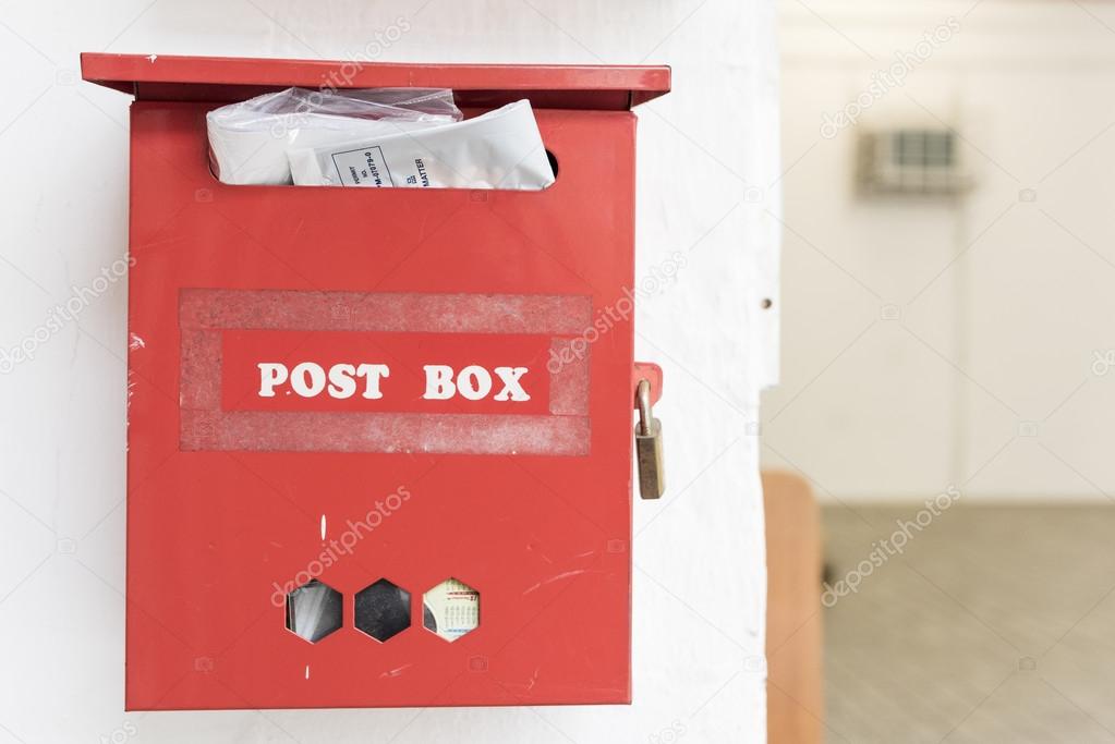 Red post box on the wall
