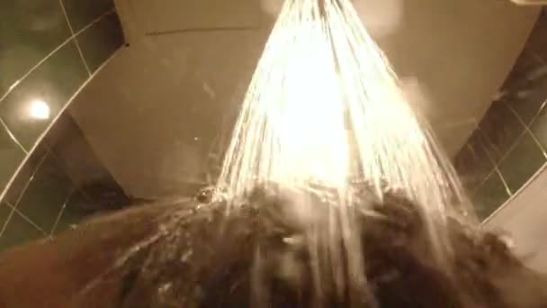 Washing hair in bathroom shower — Stock Video