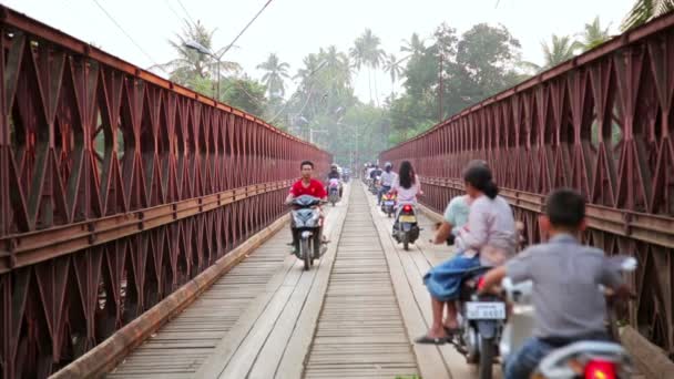 Motorbikes crossing historical bridge — Stock Video