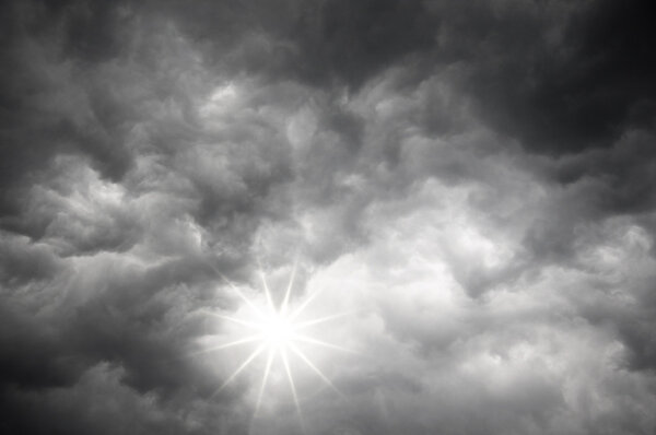 Sun shines from Darkclouds of storm sky