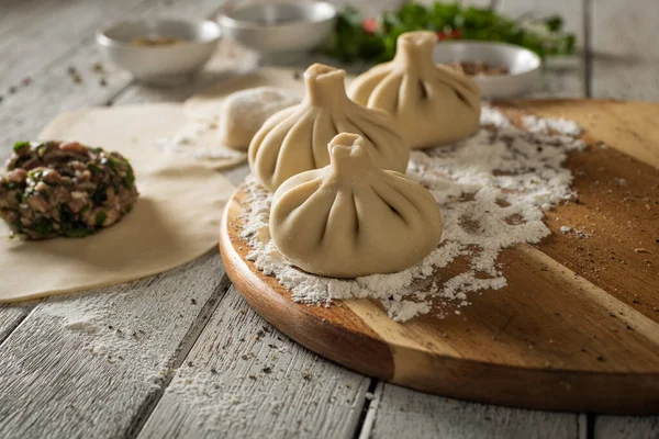 Close Caucasian Khinkali Dumplings Dish Served Plate Background Ingredients Scattered Rechtenvrije Stockafbeeldingen