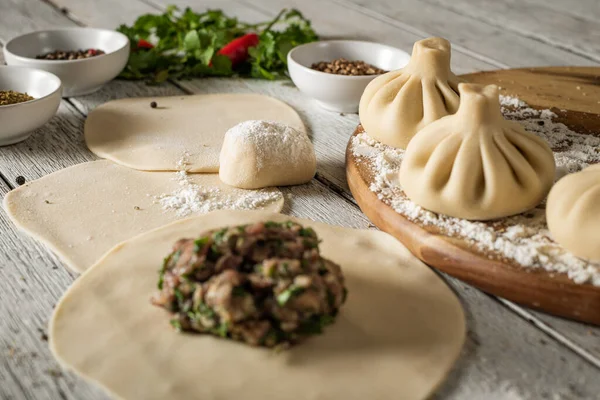 Close Caucasian Khinkali Dumplings Dish Served Plate Background Ingredients Scattered Stockfoto