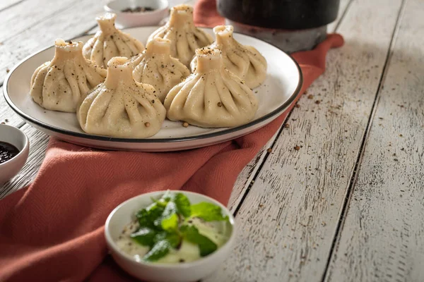 Close Caucasian Khinkali Dumplings Dish Served Plate Background Ingredients Scattered Rechtenvrije Stockfoto's