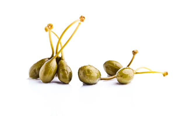 Canned capers on white reflective background — Stock Photo, Image