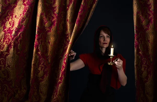 Woman with candlestick — Stock Photo, Image