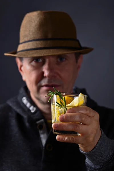 Man with a glass of lemon drink — Stock Photo, Image