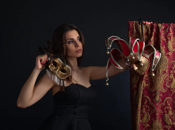 Beautiful woman with gold carnival masks — Stock Photo, Image