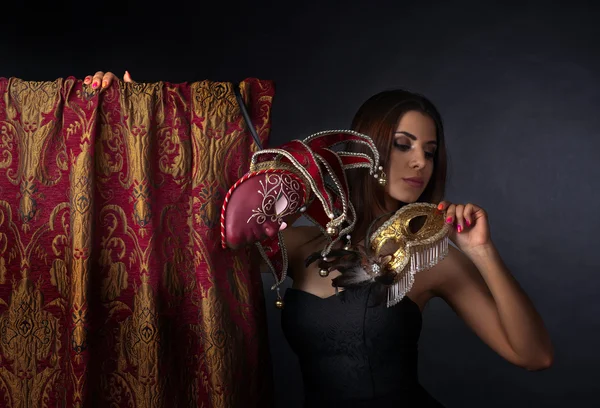 Beautiful woman with gold carnival masks — Stock Photo, Image