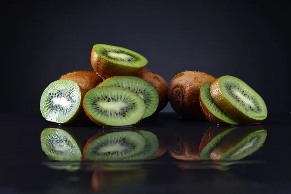 Kiwi on a black background — Stock Photo, Image