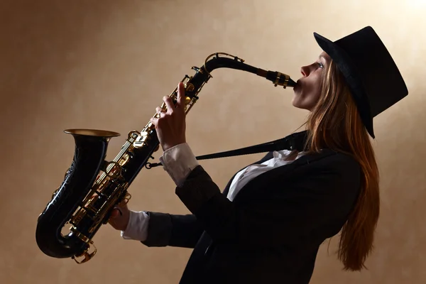 Young beautiful woman with saxophone — Stock Photo, Image