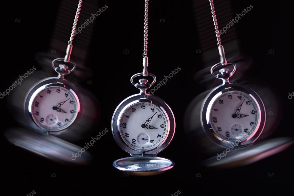 Pocket watch swinging on a chain to hypnotise — Stock Photo © igorr1