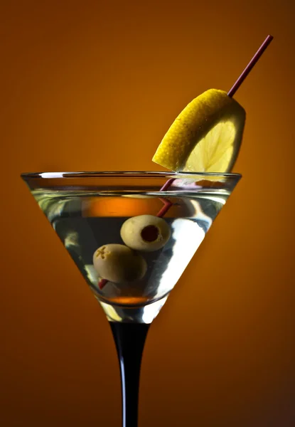 Martini with lemon and green olives — Stock Photo, Image