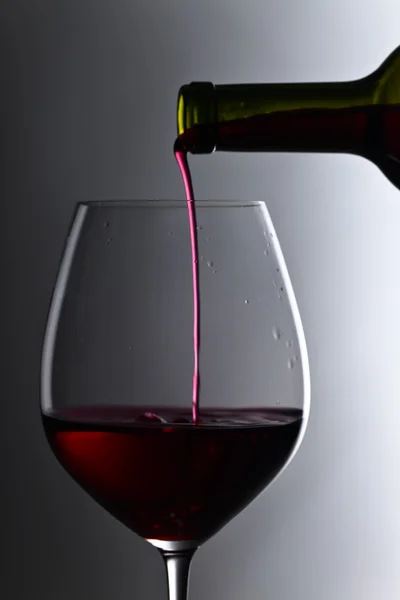 Bottle and glass of red wine — Stock Photo, Image