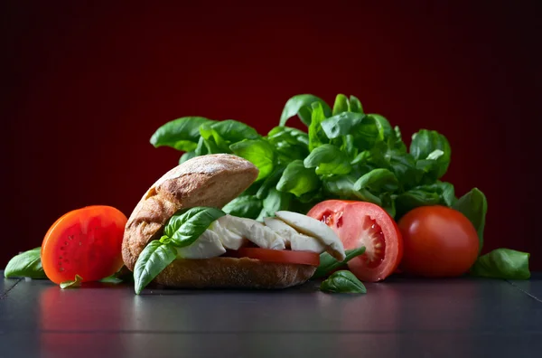 Sandwich with mozzarella, tomato and basil — Stock Photo, Image