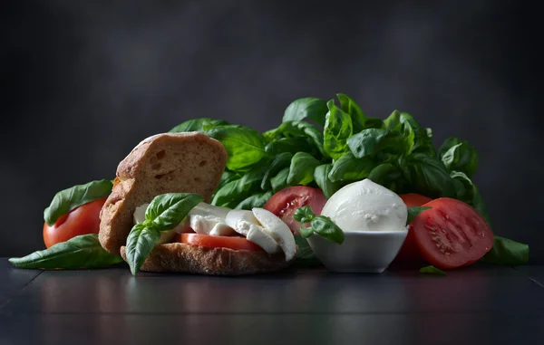 Sandwich with mozzarella, tomato and basil — Stock Photo, Image