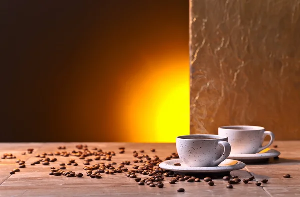 Cups of black coffee and  beans — Stock Photo, Image