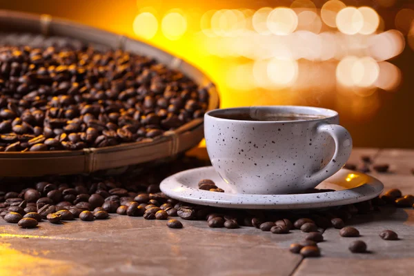 Cup of black coffee and  beans — Stock Photo, Image