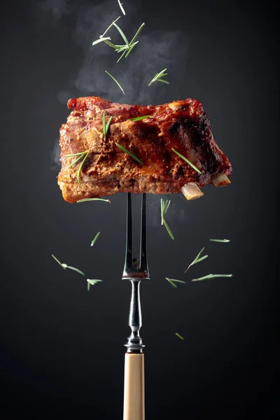 Grilled Pork Ribs Fork Grilled Meat Sprinkled Rosemary Black Background — Stock Photo, Image