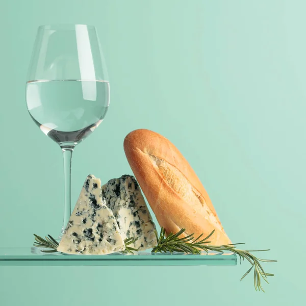 Blue cheese with bread, white wine and rosemary. Copy space.